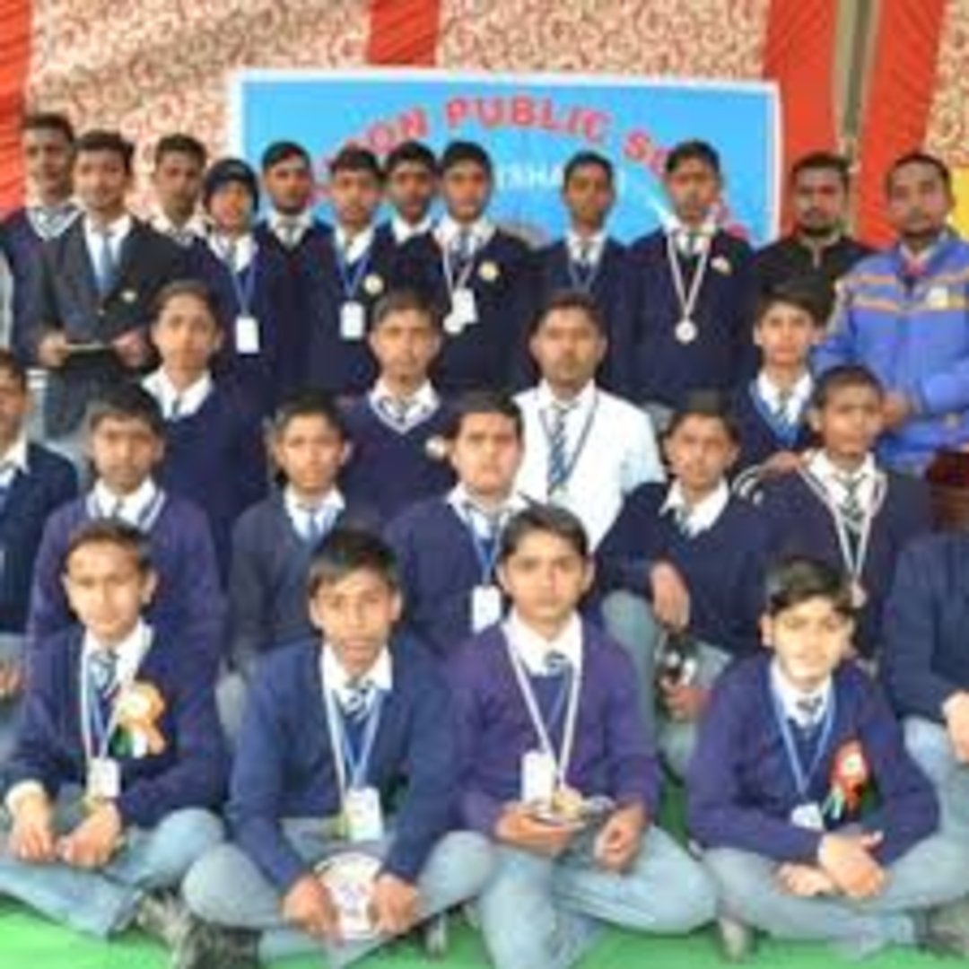 Modern school building with spacious classrooms and green playground at De'Saint Public School campus